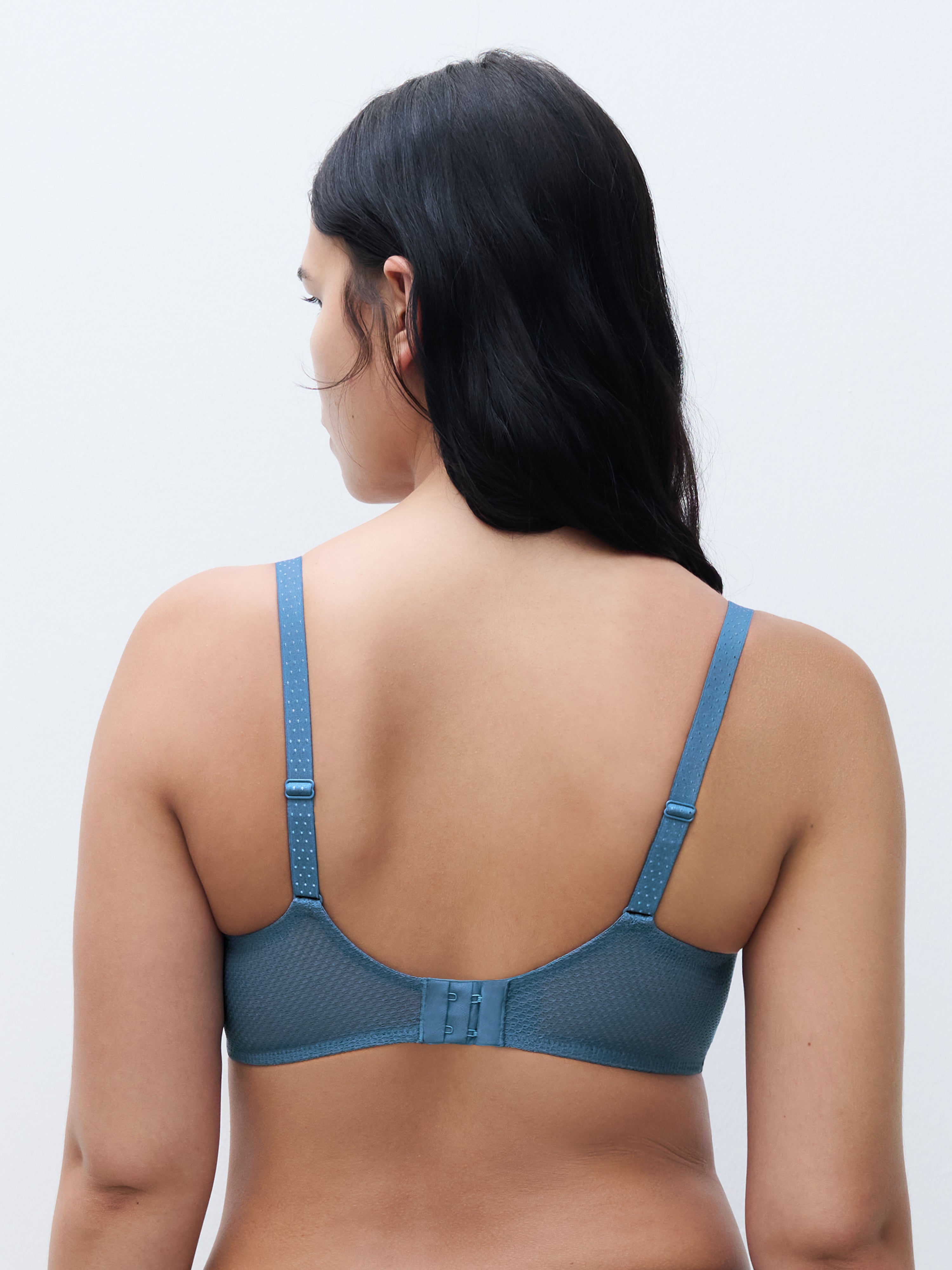 Back view of the Fleurs Signature Demi Bra in Blue Denim, highlighting the honeycomb mesh band that subtly reveals the skin and the U-shaped back for optimal support and comfort.